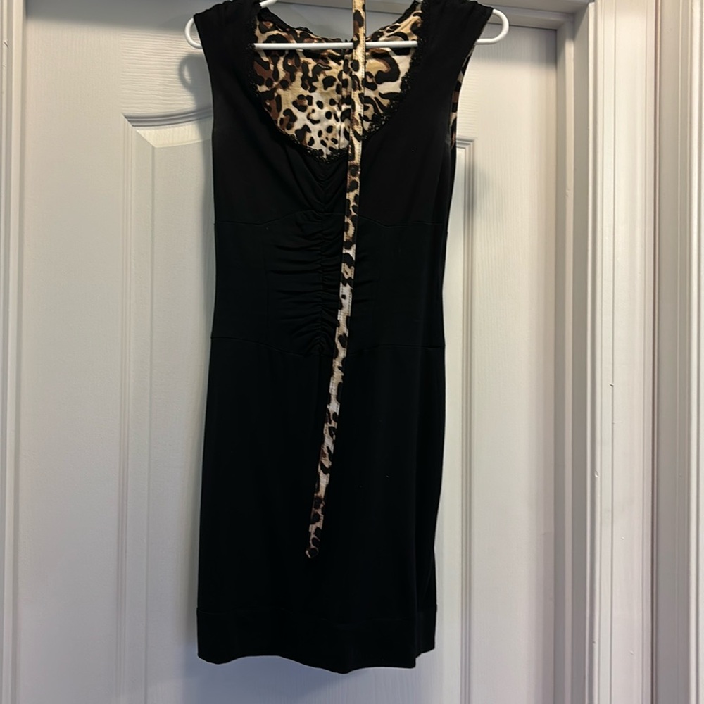 Form fitting, reversable black to cheetah body con dress